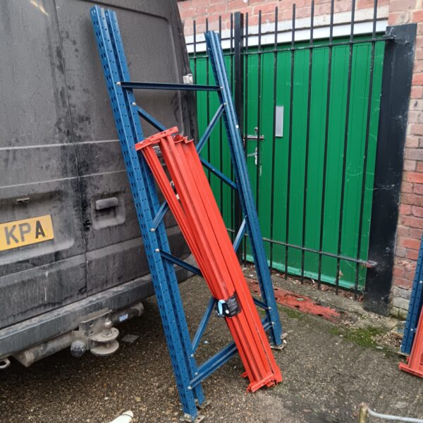 Heavy duty metal warehouse racking section for storage.