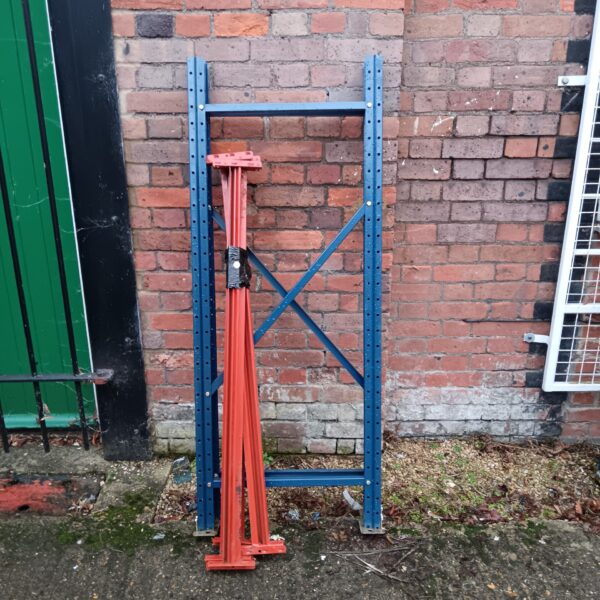 Heavy duty metal warehouse racking section for storage.