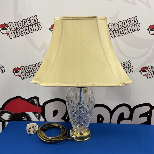 Elegant Waterford crystal table lamp with cream shade.