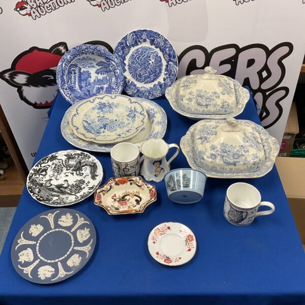 Antique Wedgwood and Royal Crown Derby china collection on display.