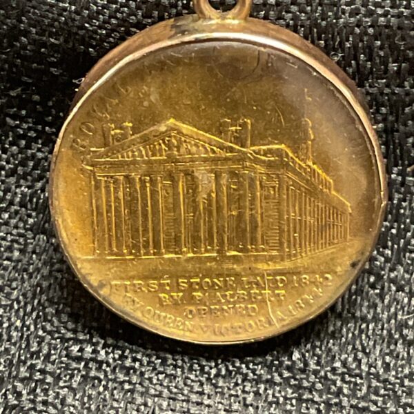 Victorian locket with Wellington statue medal obverse.