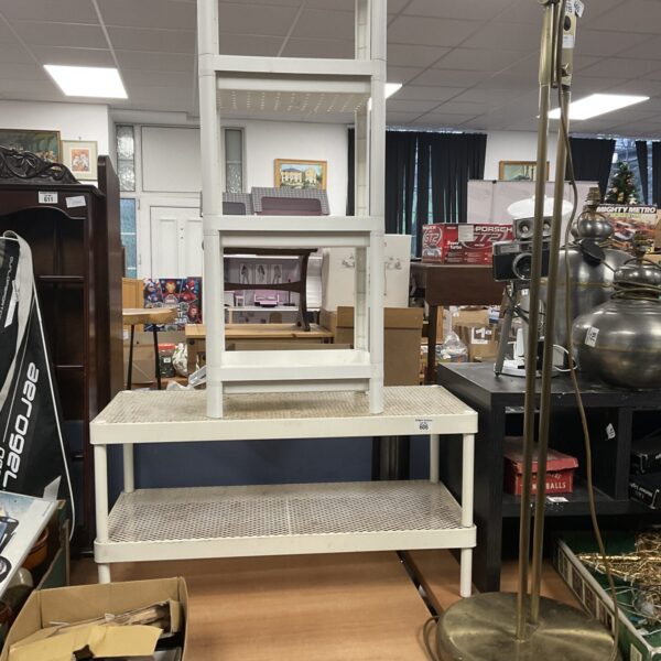 White plastic shoe rack shelf unit for storage and display.