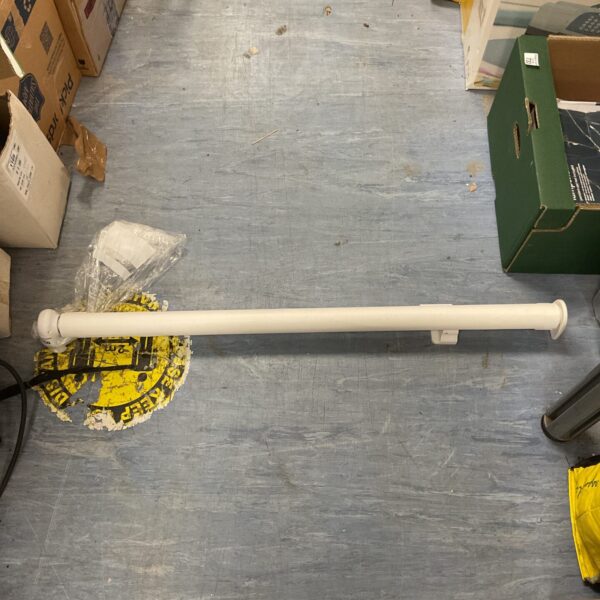 White retractable dog gate for pets and children.