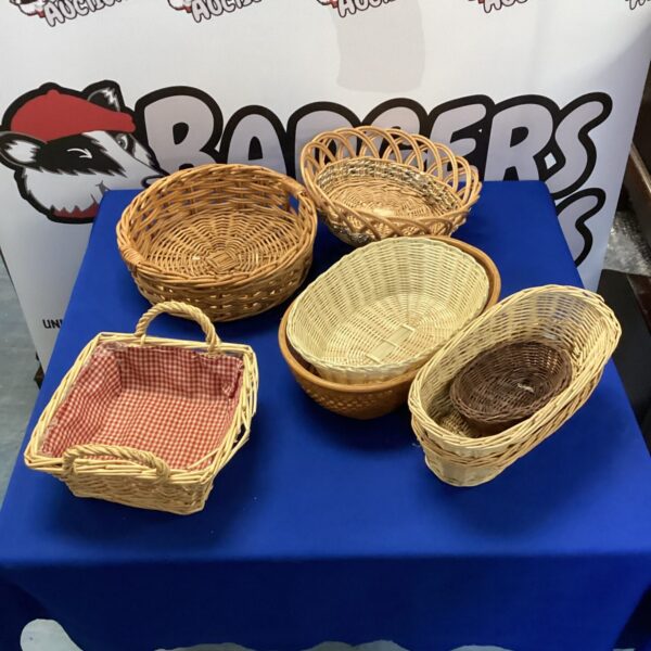 Lot of three vintage wicker baskets for storage and display.