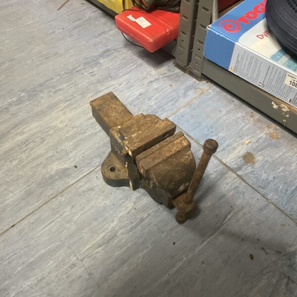 Vintage Woden bench vice for metalworking and workshop use.