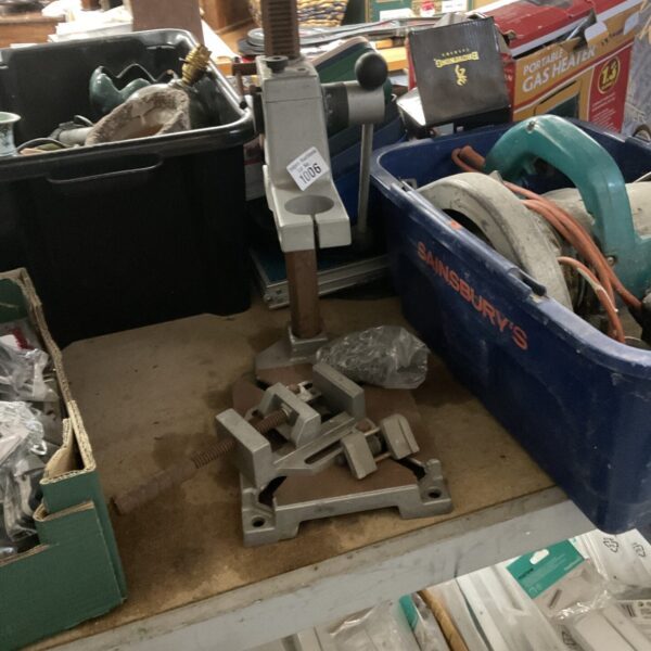 Used Wolfcraft drill stand on a workbench, ideal for DIY projects.