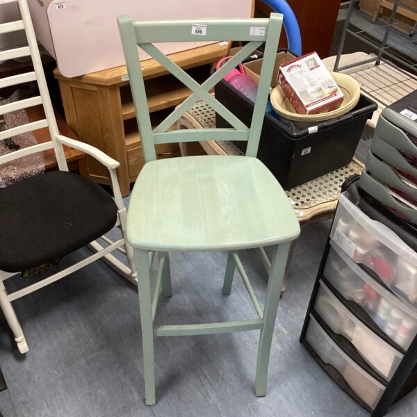 Rustic wooden bar stool with farmhouse style seating.