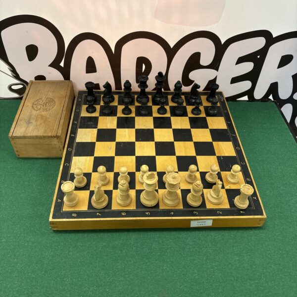 Classic wooden chess set with Staunton pieces on a wooden board.