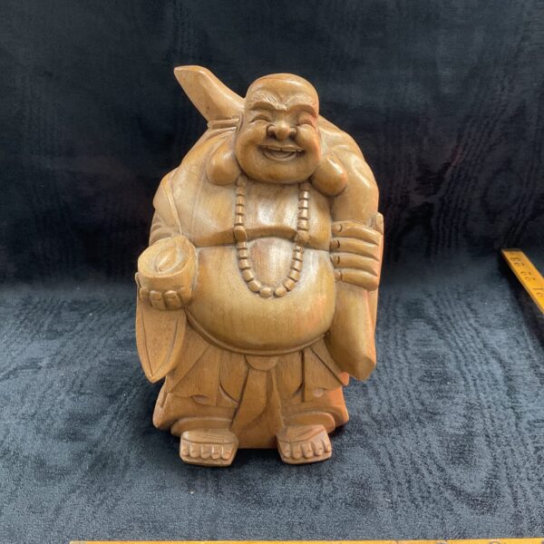 Detailed hand-carved wooden Laughing Buddha statue for home decor.