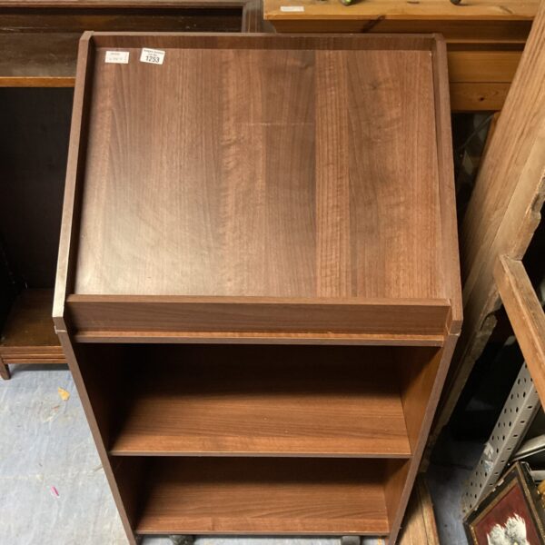 Vintage wooden lectern with a sloped reading surface.