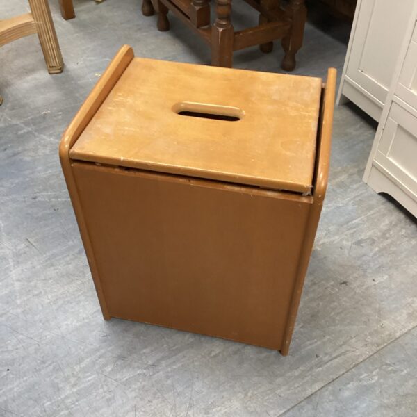 Vintage wooden storage box stool with a simple design.