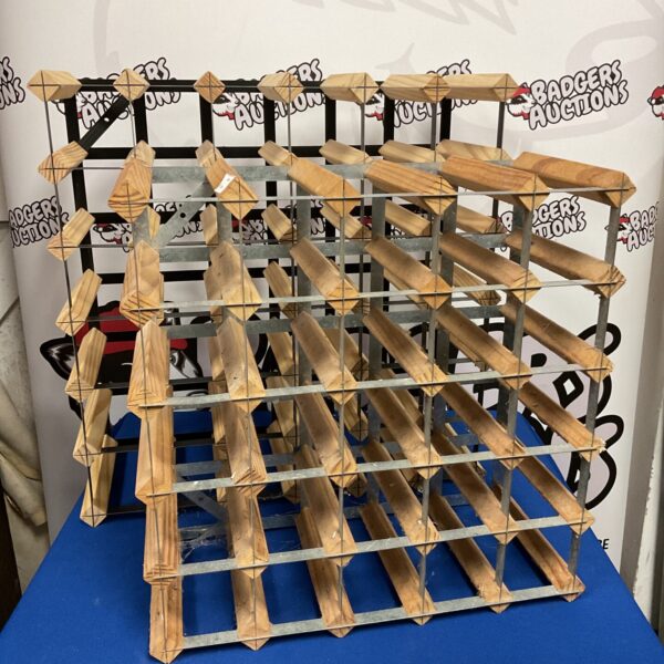Tiered wooden wine rack for storing multiple bottles.