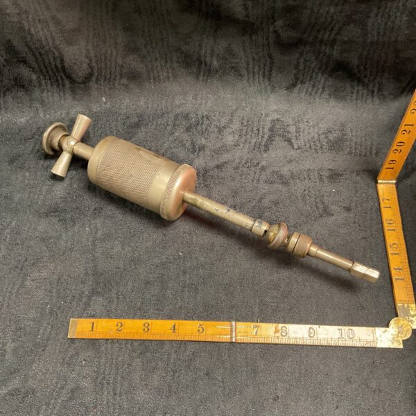 Front view of a vintage WW2 Air Ministry grease gun.