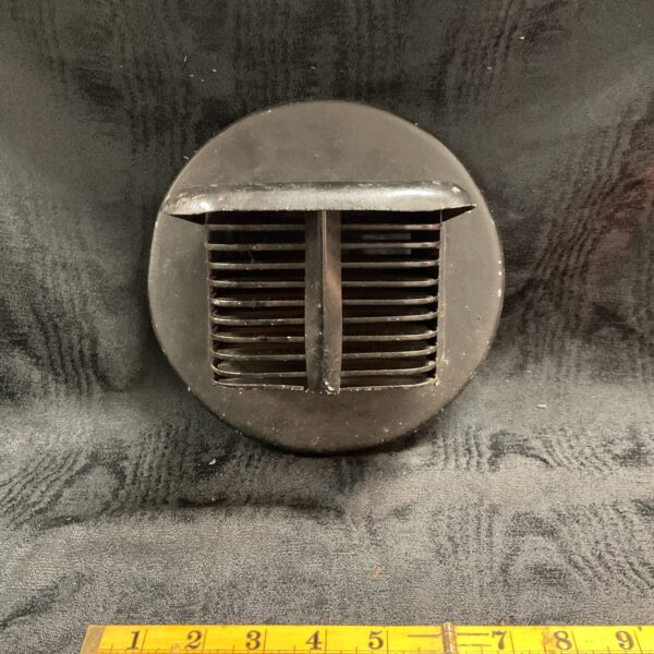 Vintage WW2 headlight blackout cover for vehicle lighting.