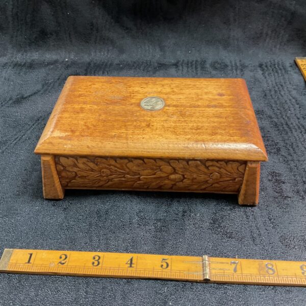 Front view of a WWII German SS oak box with carved details.