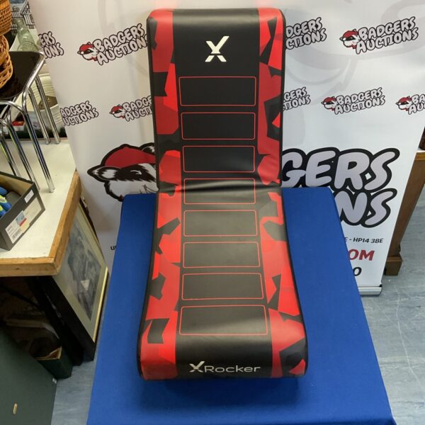 Red and black X Rocker gaming chair for immersive gaming.