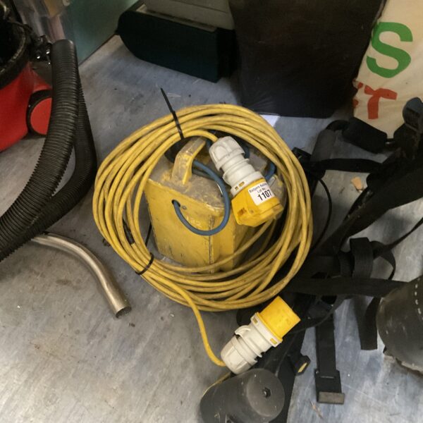 Yellow 110v transformer with long extension lead for voltage conversion.