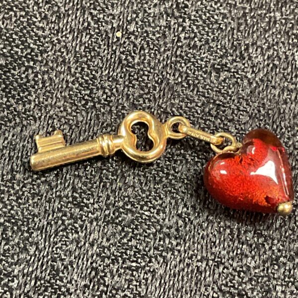 Vintage 9 carat gold heart charm with key design.
