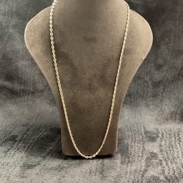 Delicate 925 silver necklace chain on a display bust.