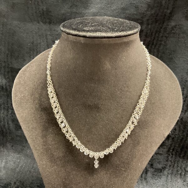 Delicate 925 silver necklace with white stones and double chain.