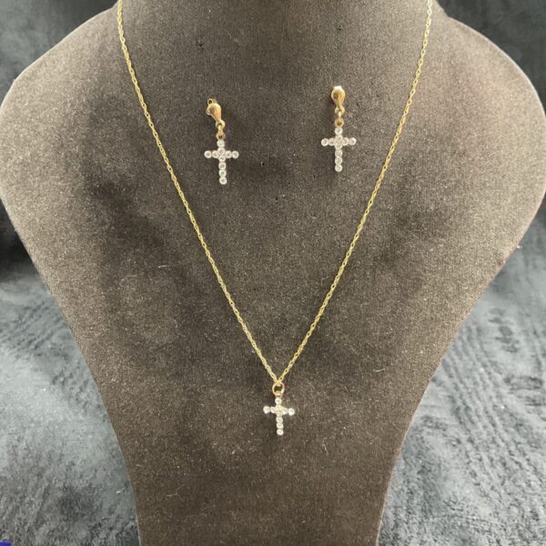 Elegant 9ct gold cross necklace and earrings set with white stones.