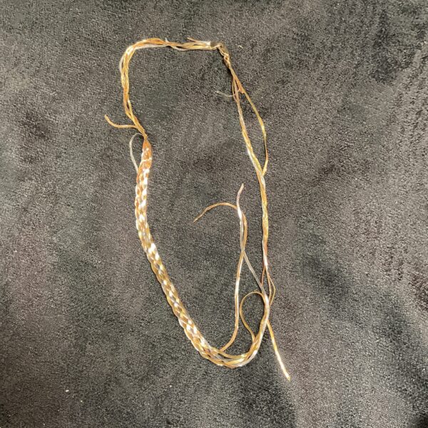 9ct gold scrap necklace with three tone design, close up view.