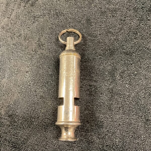 Vintage Acme scout whistle with key ring attachment.