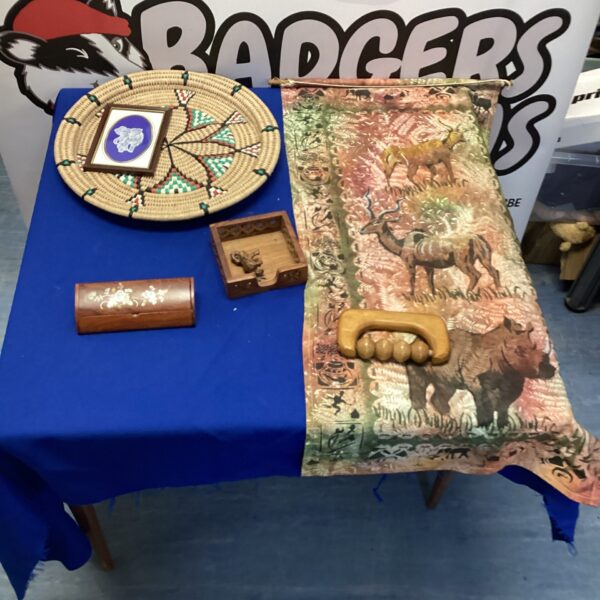 Vibrant Zimbabwe rug and woven tray in African memorabilia bundle.