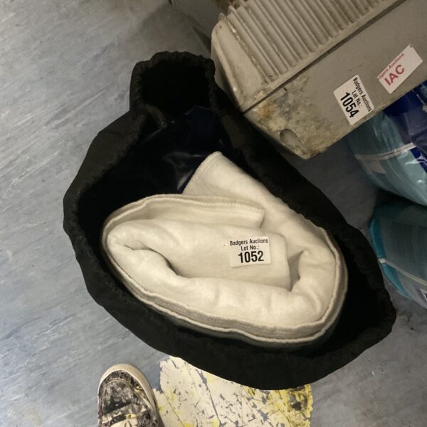 Portable airbed with heated mattress cover showing signs of use.
