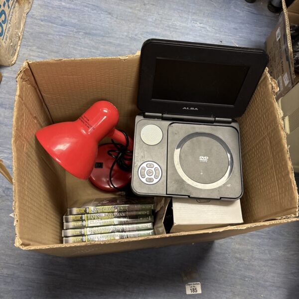 Mixed lot featuring Alba portable DVD player, DVDs and lamp.