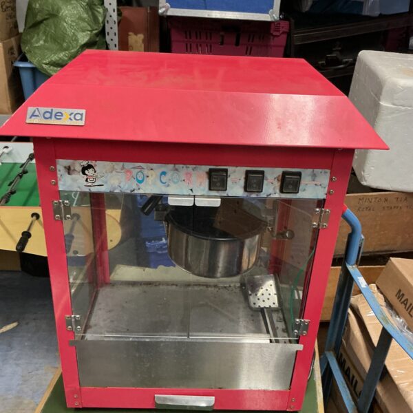 Vintage Alexa popcorn machine with clear popping chamber.