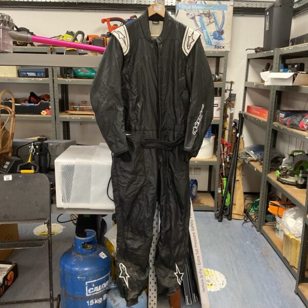 Full view of the black and white Alpinestars Atom race suit.