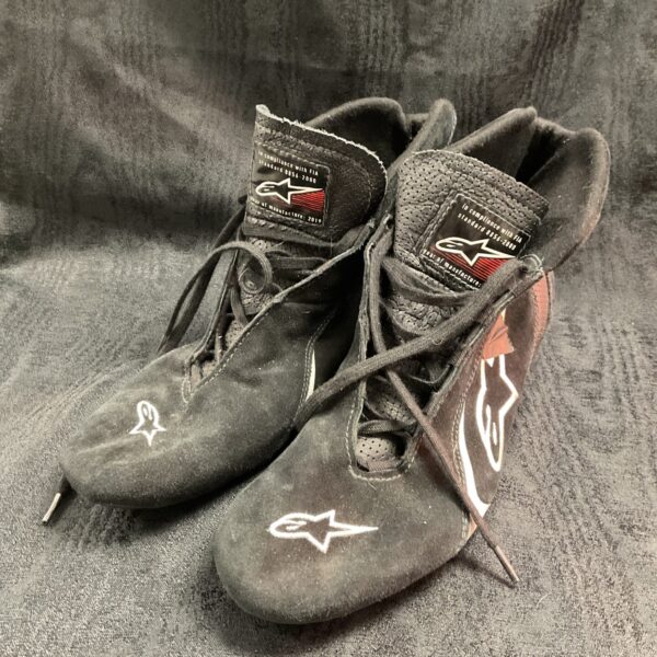 Black Alpinestars race boots, size 45.5, showing wear.