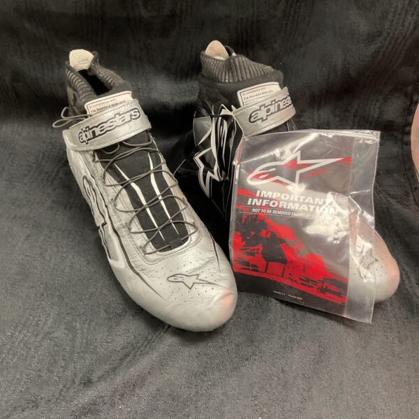 Silver Alpinestars race boots, size 44, motorsport footwear.