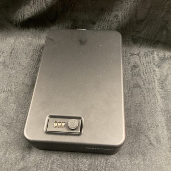 Close-up of Amazon Basics metal security case with locking mechanism.