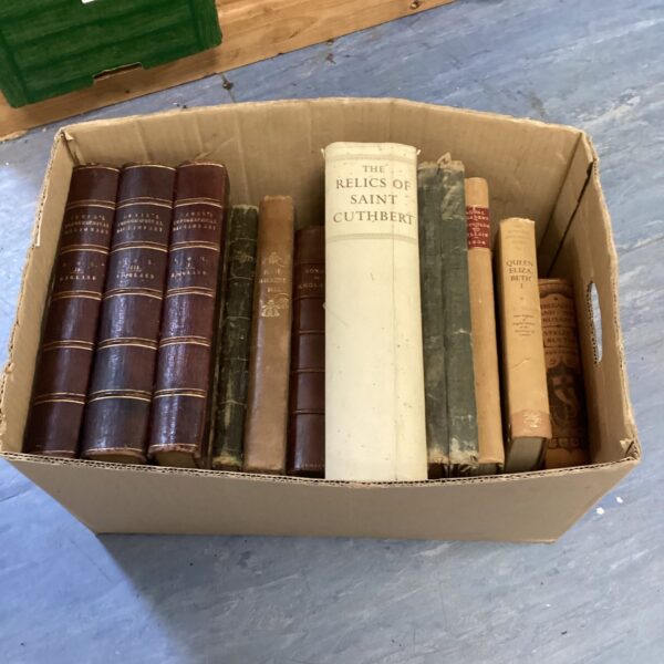 Antique book lot featuring religious texts and topographical dictionaries.