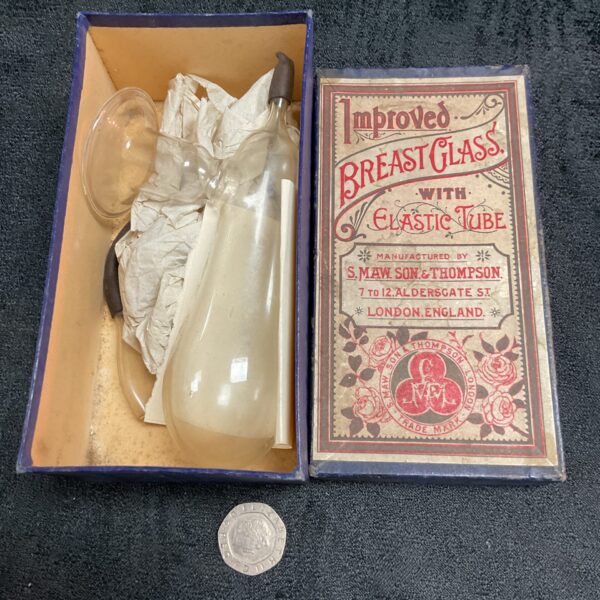 Antique breast glass by S Maw Son & Thompson in original box.