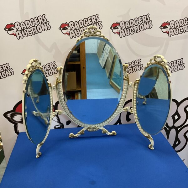 Antique cast iron trifold dressing table mirror with adjustable panels.