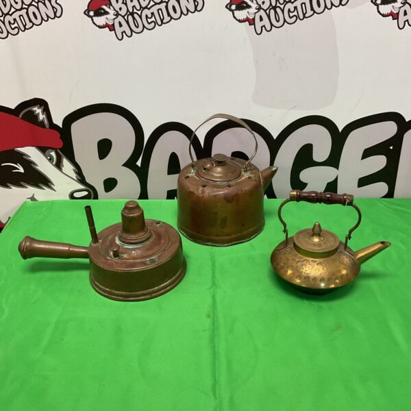 Antique copper kettle and engraved brass teapot, vintage collectibles.