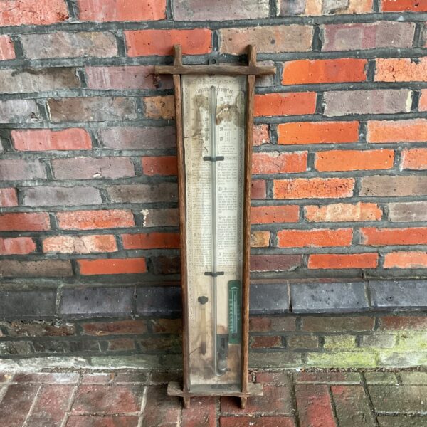Antique Fitzroy barometer with mercury tube and wooden frame.