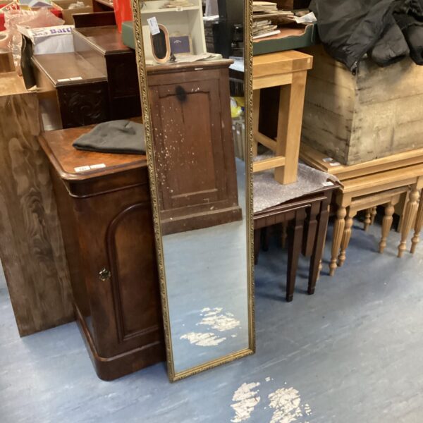 Ornate antique gilt framed mirror for wall decoration.