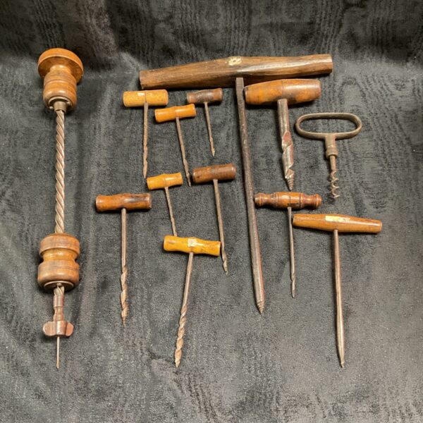 Antique gimlet collection with wooden handles and steel points.