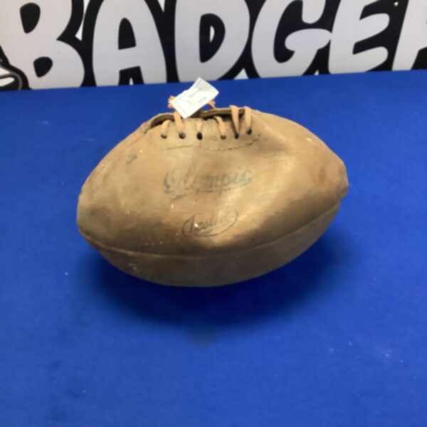 Antique hand-sewn leather rugby ball, vintage sports equipment.