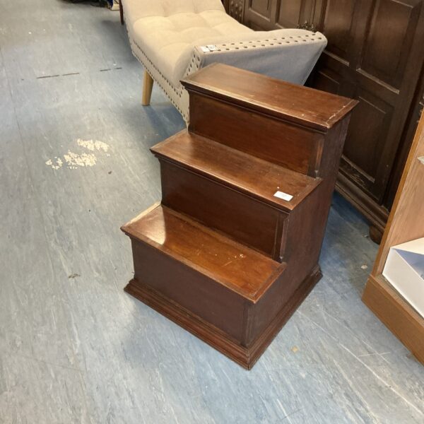 Antique mahogany library steps for reaching high shelves.