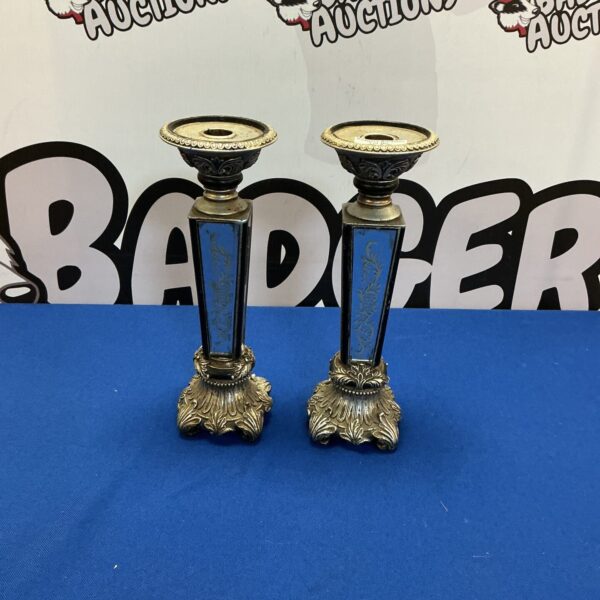 Antique silver plate mirrored candle sticks for elegant home decor.