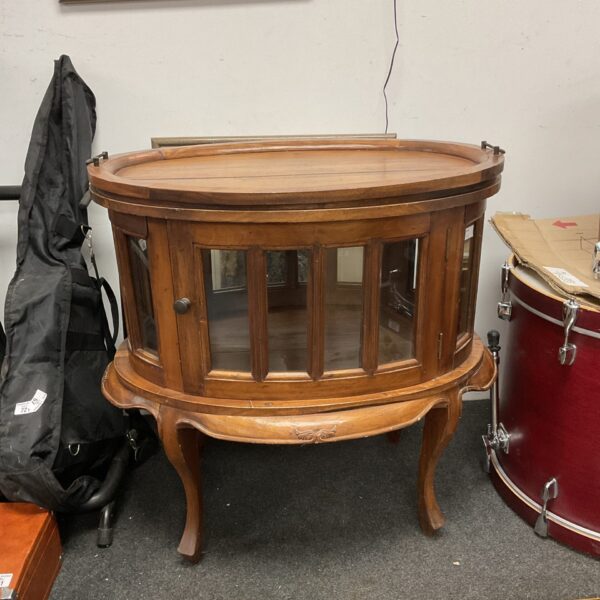 Antique oval drinks cabinet with serving tray top.