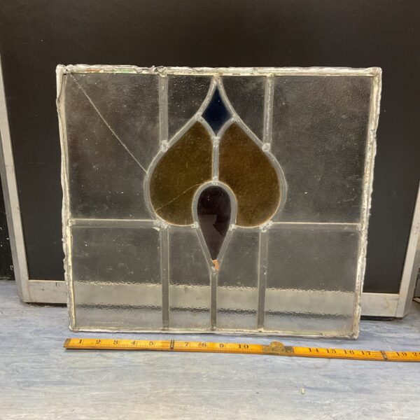 Antique stained glass panel with amber glass and lead came.