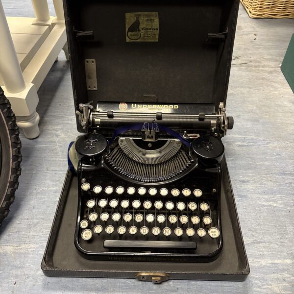 Antique Underwood typewriter with its original carrying case.