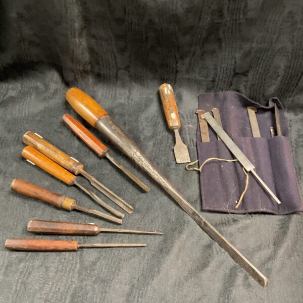 Antique wood turning chisels with canvas pouch, vintage woodworking tools.