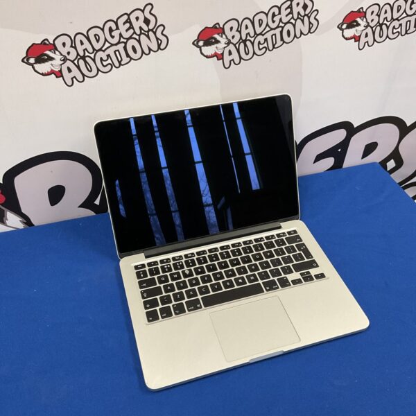 Silver Apple Macbook Pro A1425 laptop with open screen.
